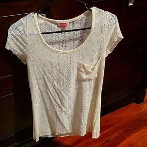 Sheer short sleeved shirt cream colored. Size adults XS